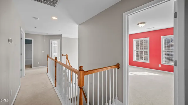 a view of a hallway with windows