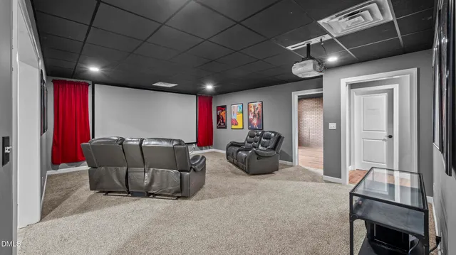 a living room with furniture a ceiling fan and a rug