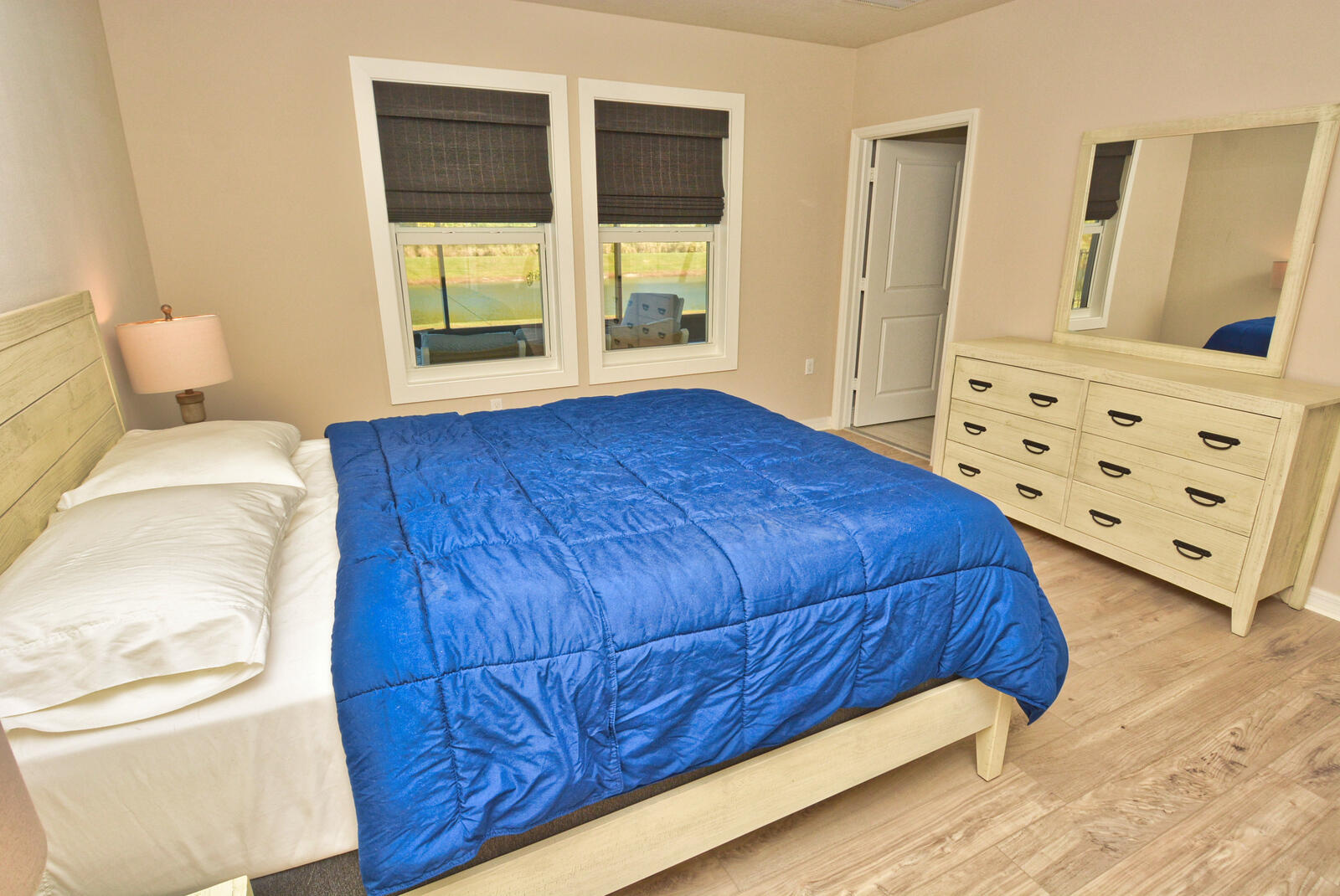 3524 Carriage Pointe Circle Fort Pierce, FL 34981 - Photo 20 of 55 a bedroom with a bed and wooden floor