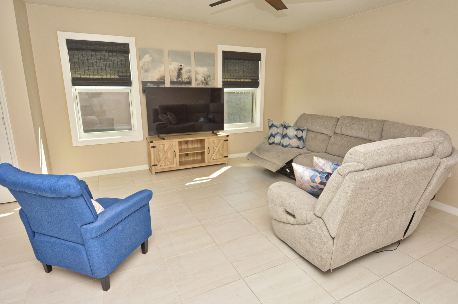 3524 Carriage Pointe Circle Fort Pierce, FL 34981 - Photo 28 of 55 a living room with furniture a flat screen tv and a window