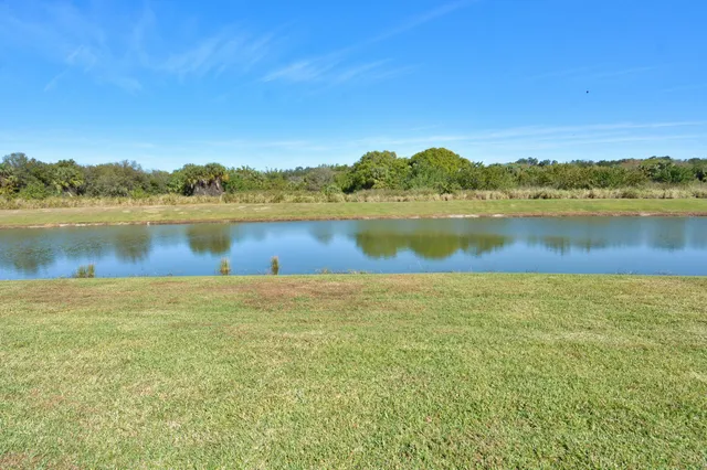 a house view with swimming pool in front of it