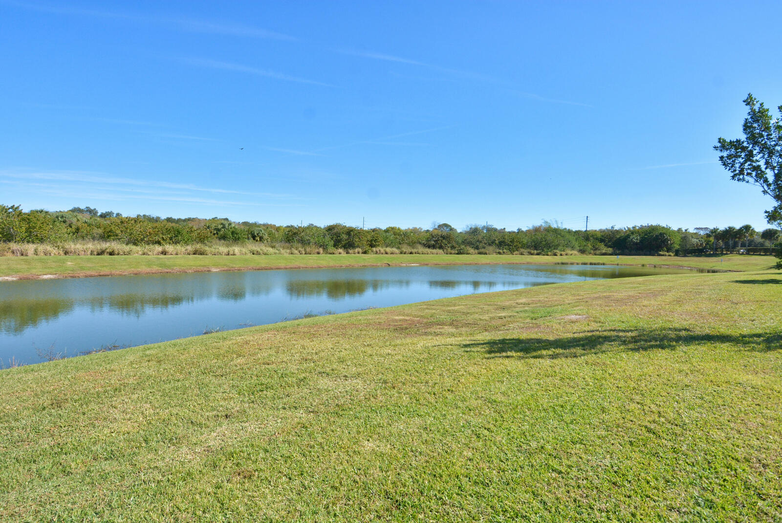 3524 Carriage Pointe Circle Fort Pierce, FL 34981 - Photo 40 of 55 a view of a lake with houses in the background