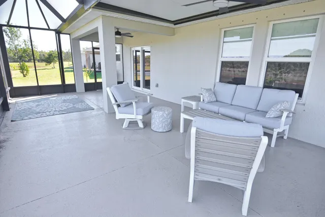 a view of a swimming pool with a lounge chair