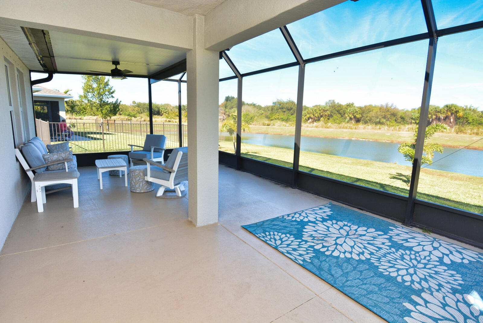3524 Carriage Pointe Circle Fort Pierce, FL 34981 - Photo 52 of 55 a view of a floor to ceiling window and an outdoor kitchen