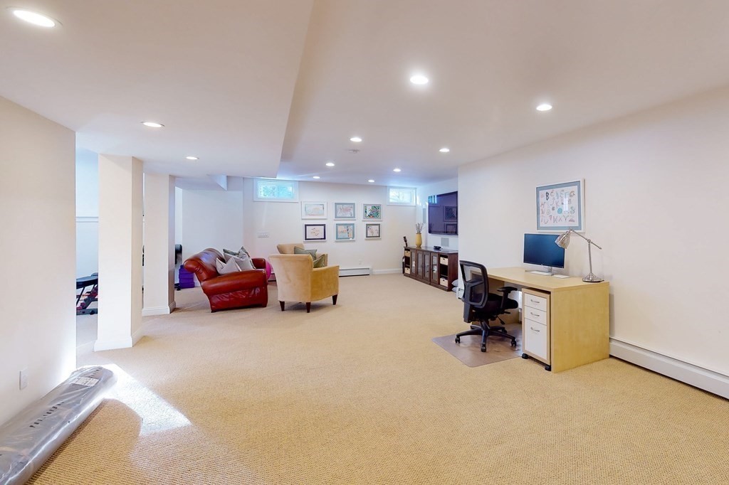 94 Arch Street Needham, MA 02492 - Photo 17 of 23 a living room with furniture and a couch