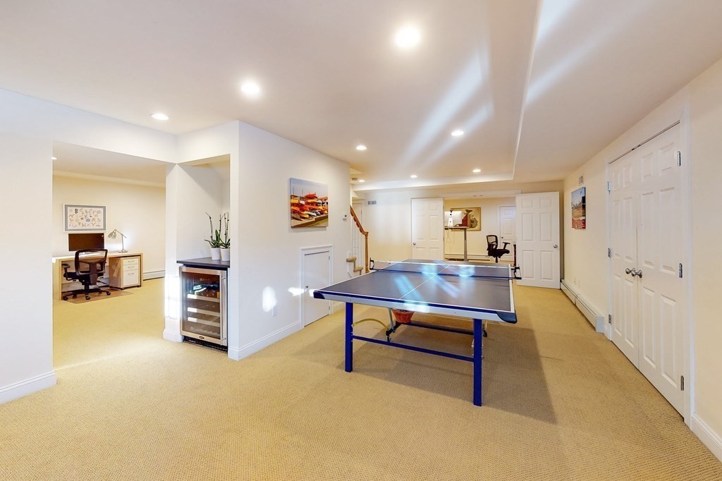 94 Arch Street Needham, MA 02492 - Photo 19 of 23 a view of a livingroom with furniture and a potted plant