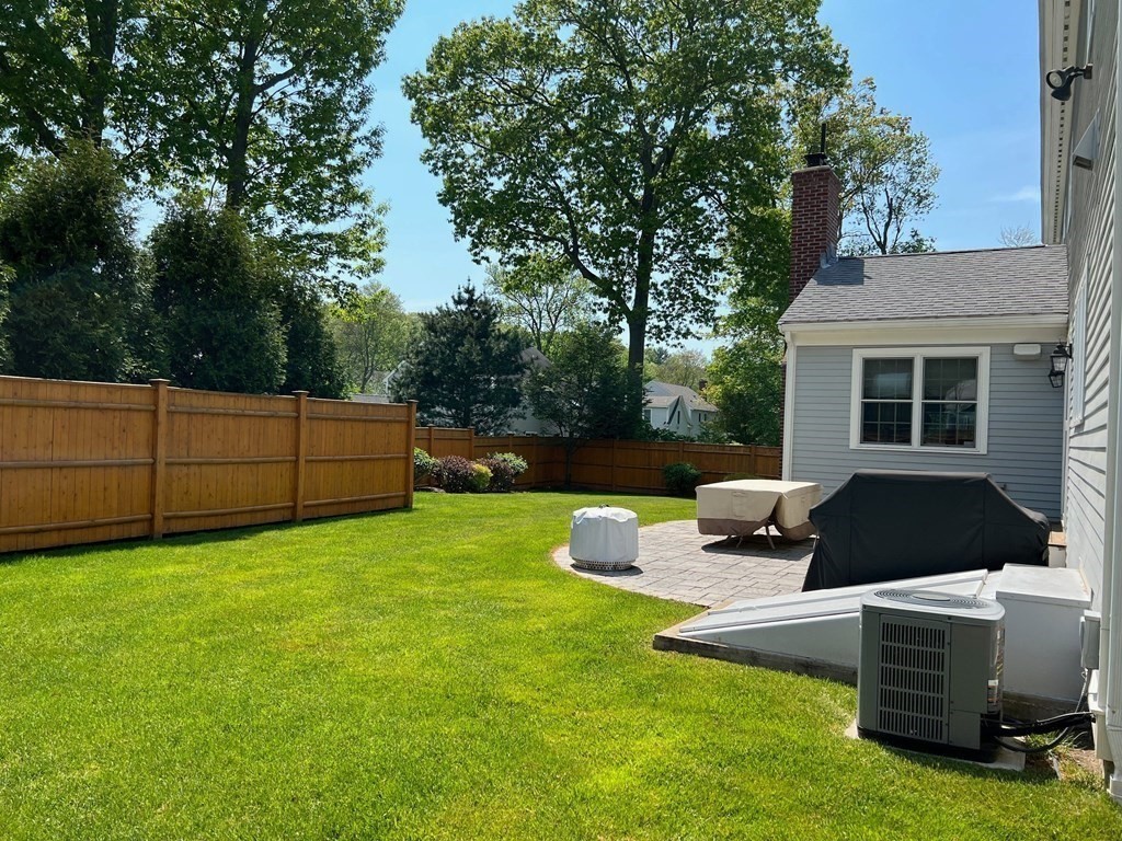 94 Arch Street Needham, MA 02492 - Photo 21 of 23 a view of backyard with seating area and green space