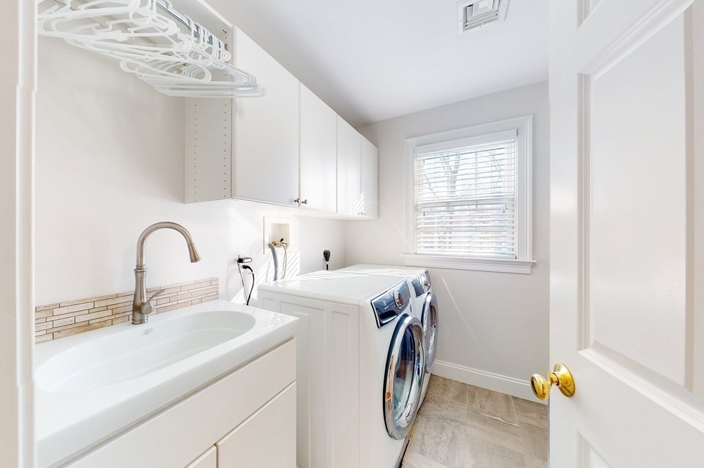 94 Arch Street Needham, MA 02492 - Photo 23 of 23 a view of storage and utility room with washer and dryer