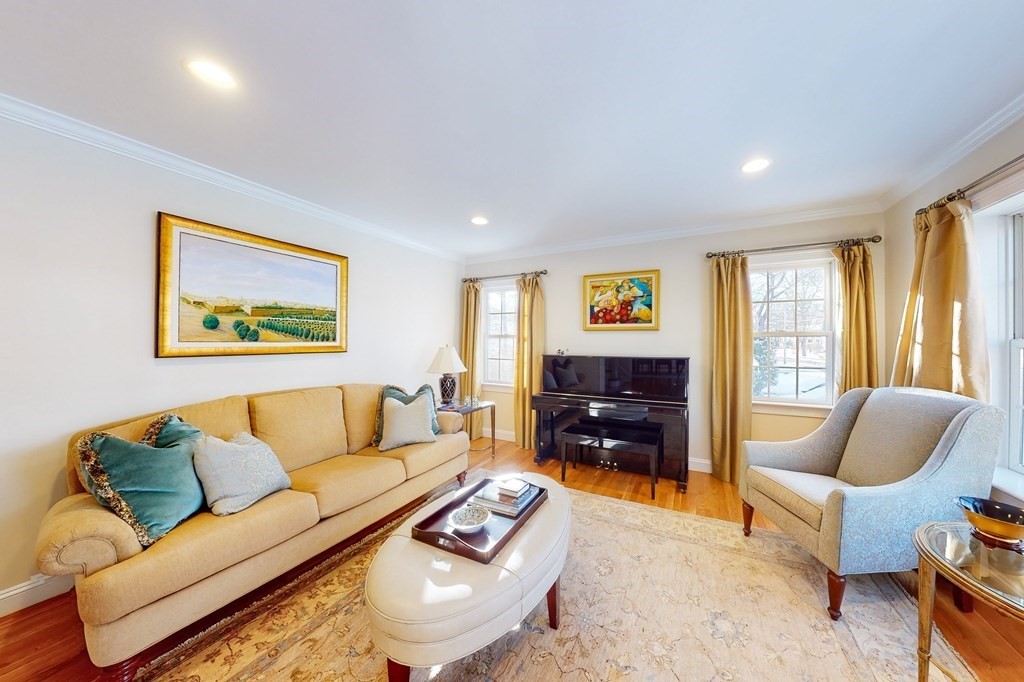 94 Arch Street Needham, MA 02492 - Photo 5 of 23 a living room with furniture and a flat screen tv