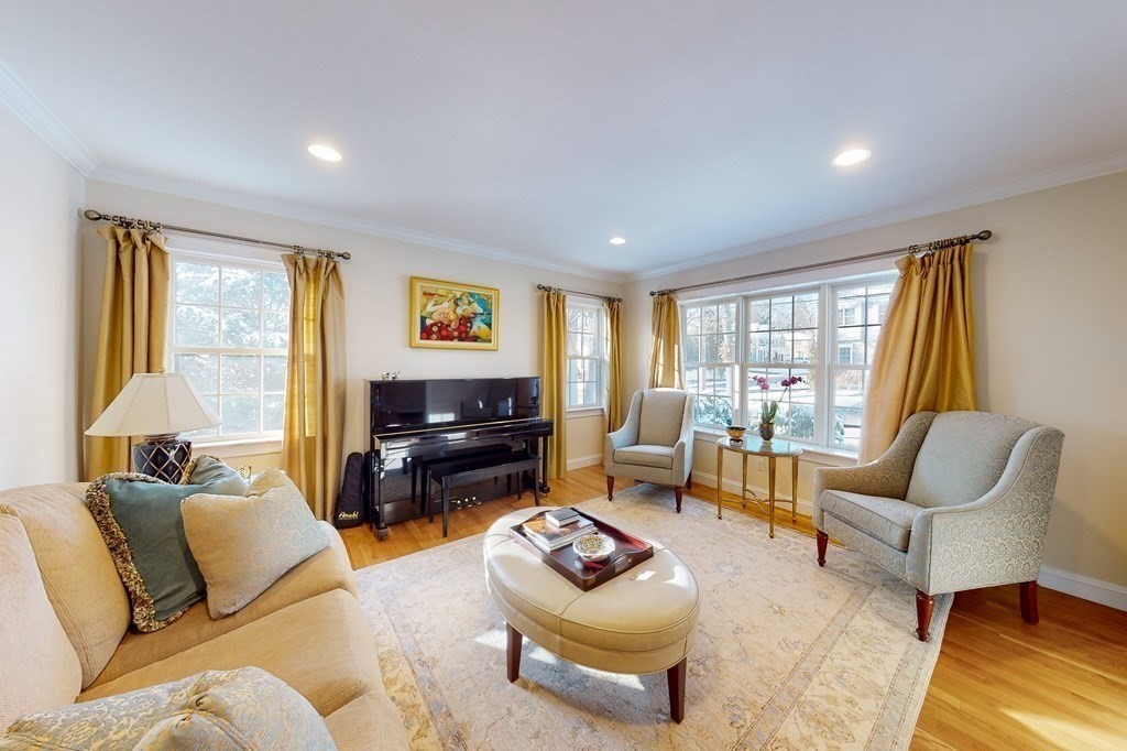 94 Arch Street Needham, MA 02492 - Photo 6 of 23 a living room with furniture and a flat screen tv