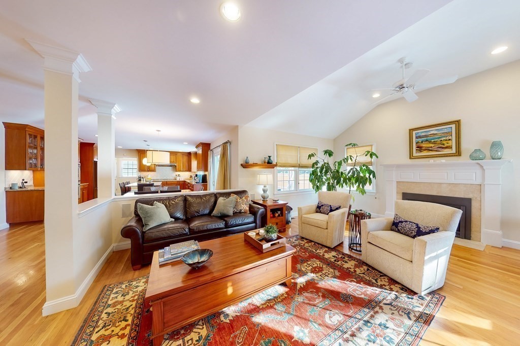 94 Arch Street Needham, MA 02492 - Photo 7 of 23 a living room with furniture and a fireplace