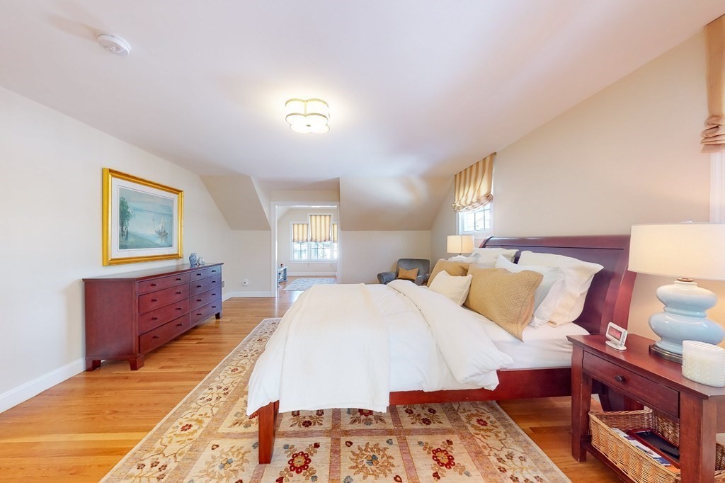 94 Arch Street Needham, MA 02492 - Photo 10 of 23 a bed room with a bed and a lamp