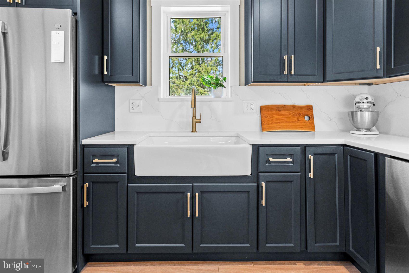 510 Overcrest Road Towson, MD 21286 - Photo 14 of 47 a kitchen with a refrigerator and a sink