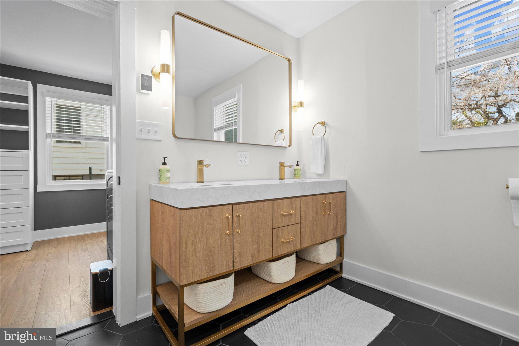 510 Overcrest Road Towson, MD 21286 - Photo 23 of 47 a bathroom with a sink mirror and vanity