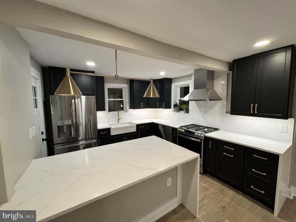 510 Overcrest Road Towson, MD 21286 - Photo 3 of 47 a kitchen with stainless steel appliances a sink a stove a refrigerator and cabinets