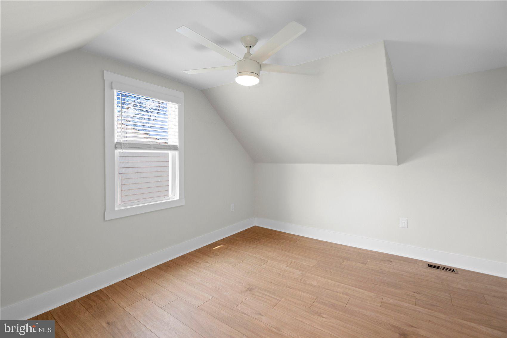510 Overcrest Road Towson, MD 21286 - Photo 37 of 47 an empty room with wooden floor and windows