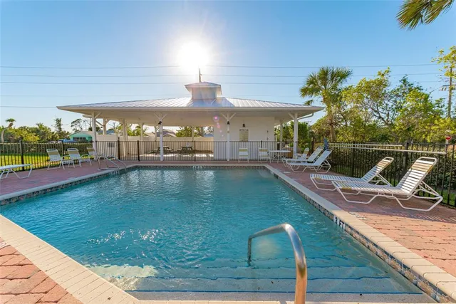 a view of a swimming pool with a patio