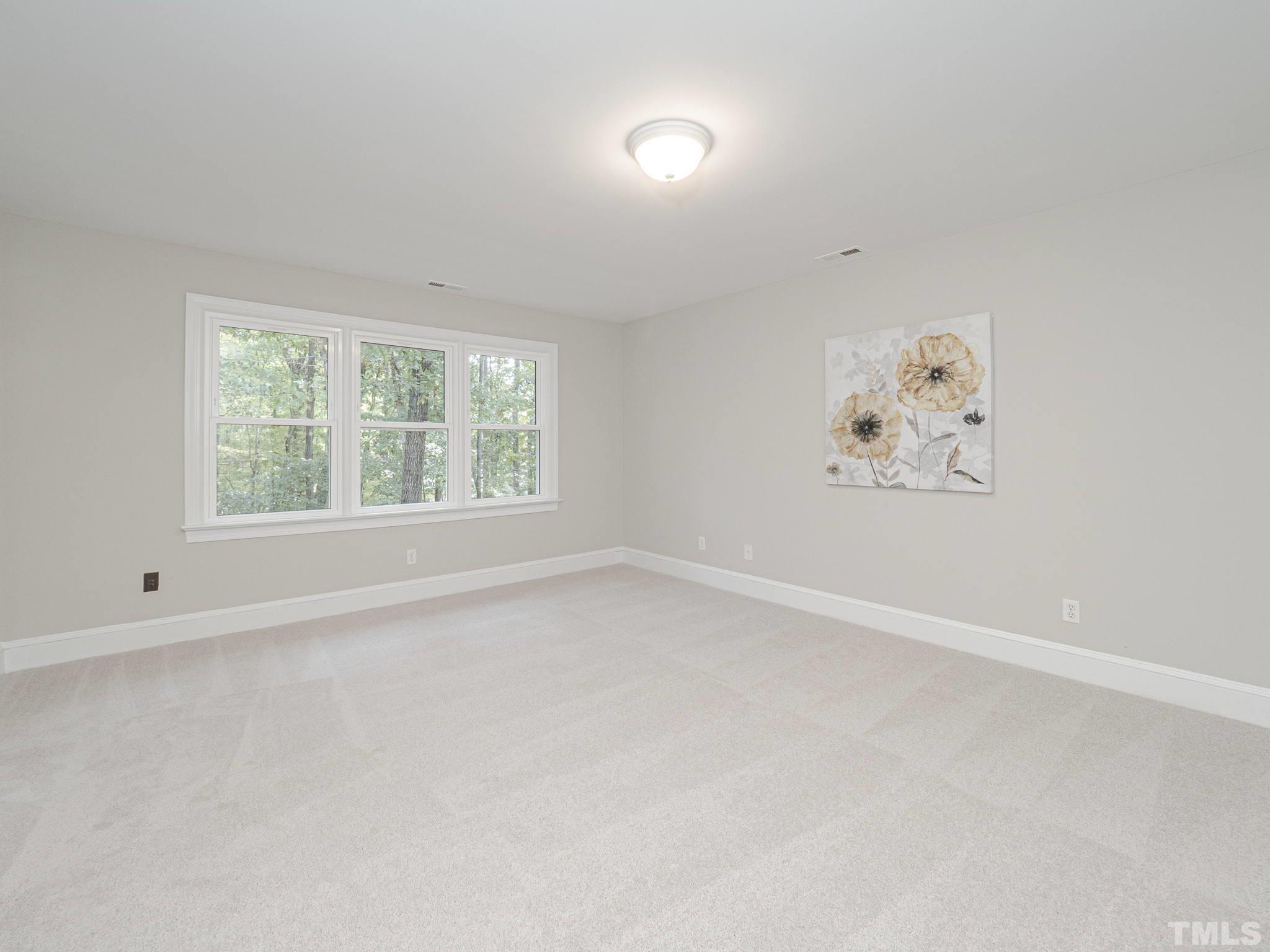 11936 Appaloosa Run East Raleigh, NC 27613 - Photo 19 of 30 an empty room with a window