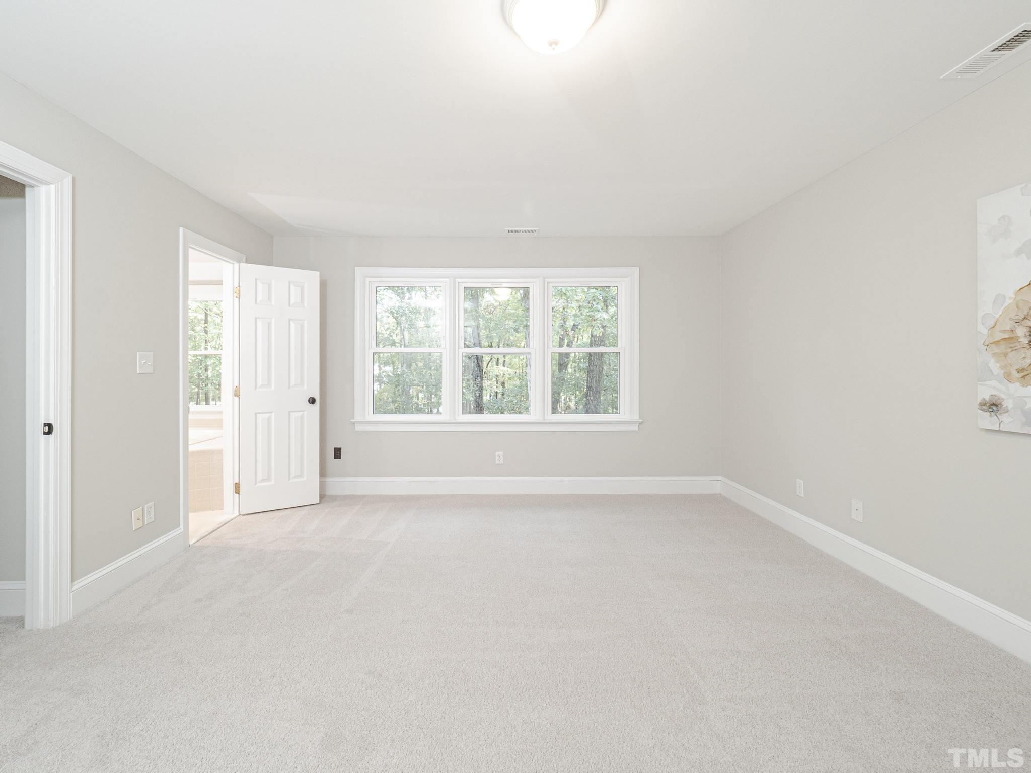 11936 Appaloosa Run East Raleigh, NC 27613 - Photo 20 of 30 an empty room with windows