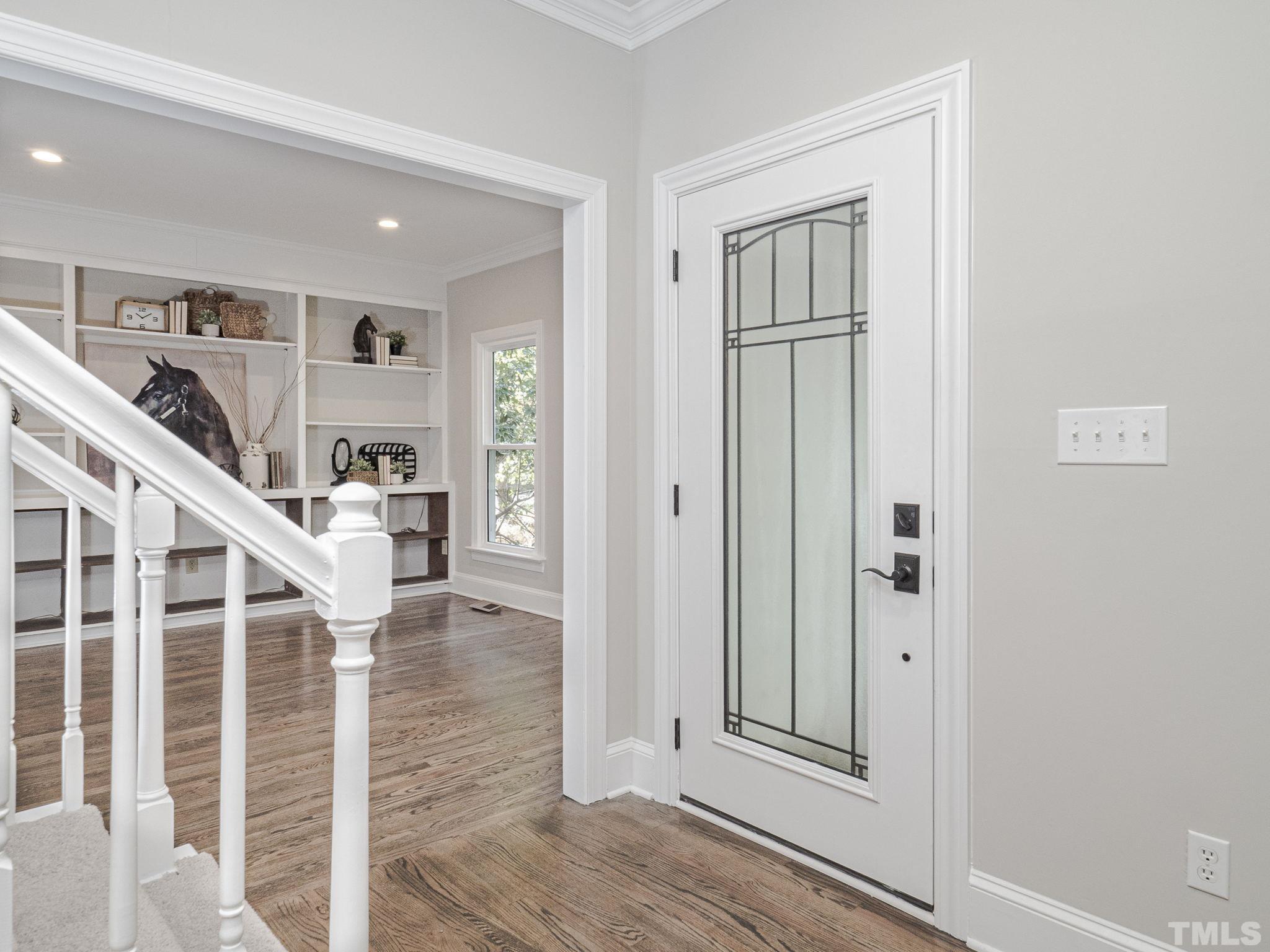 11936 Appaloosa Run East Raleigh, NC 27613 - Photo 3 of 30 wooden floor with white walls and windows