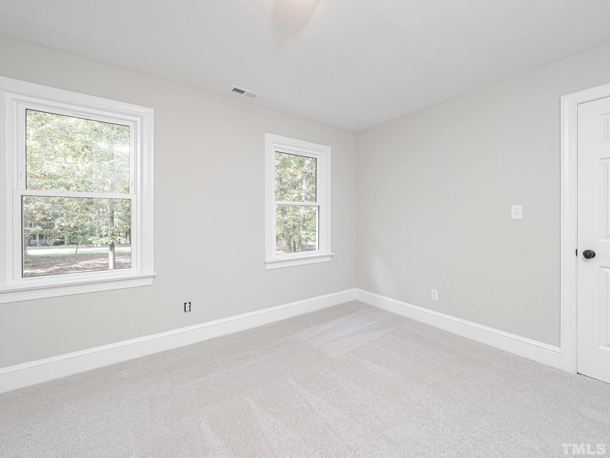 11936 Appaloosa Run East Raleigh, NC 27613 - Photo 25 of 30 an empty room with a window
