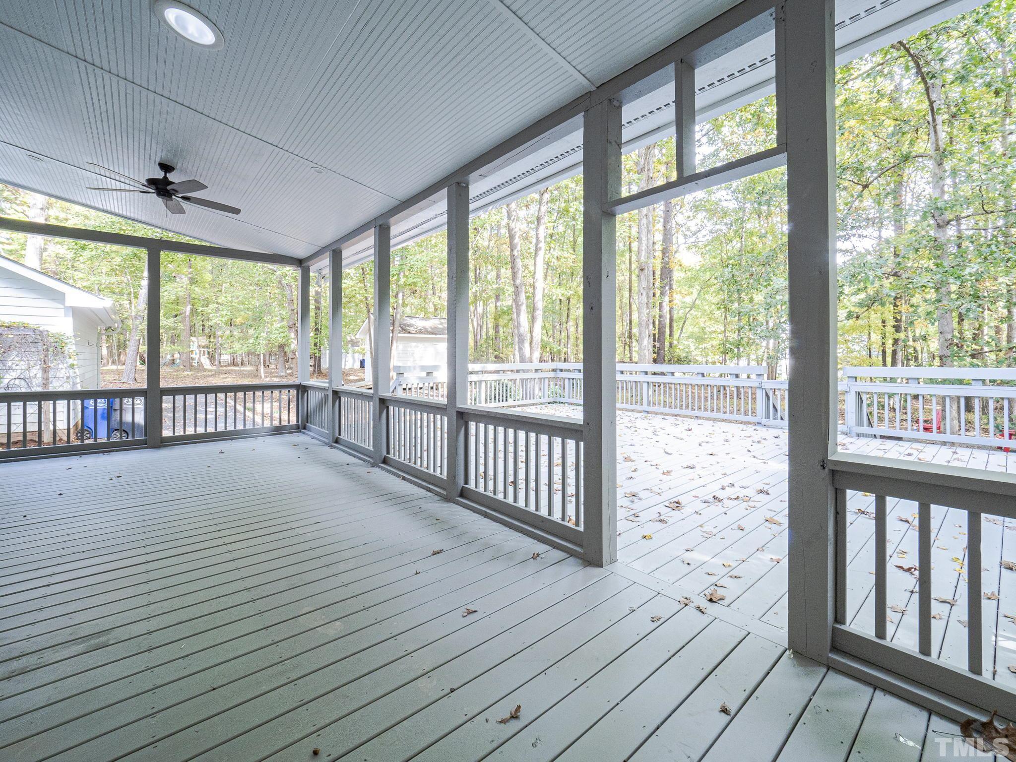 11936 Appaloosa Run East Raleigh, NC 27613 - Photo 28 of 30 a view of a room with wooden floor and large window
