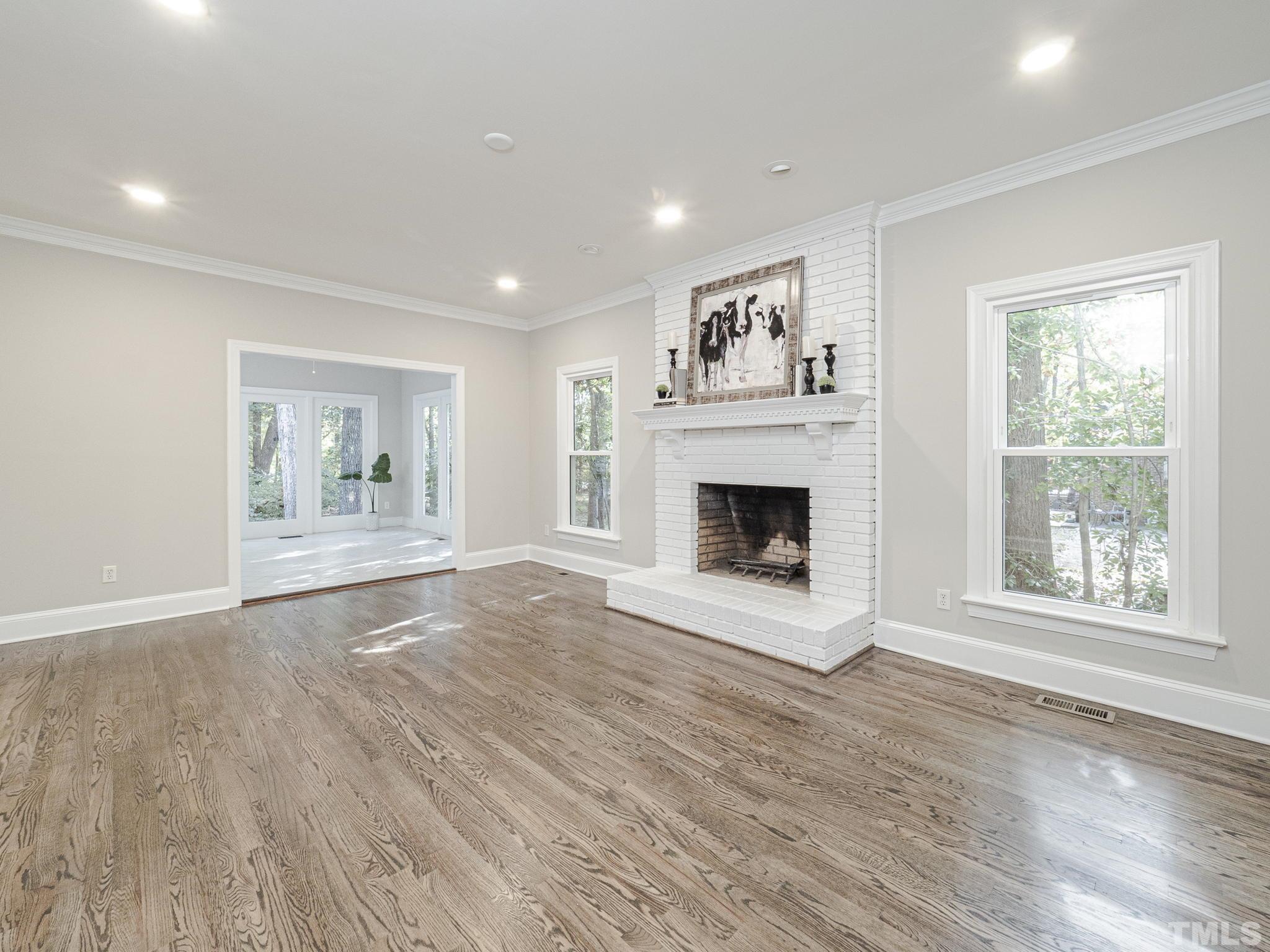 11936 Appaloosa Run East Raleigh, NC 27613 - Photo 8 of 30 a view of an empty room with window and fire place