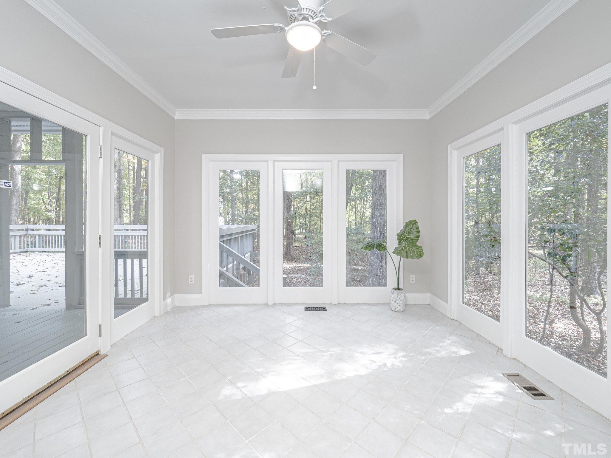 11936 Appaloosa Run East Raleigh, NC 27613 - Photo 9 of 30 a view of an empty room with a balcony