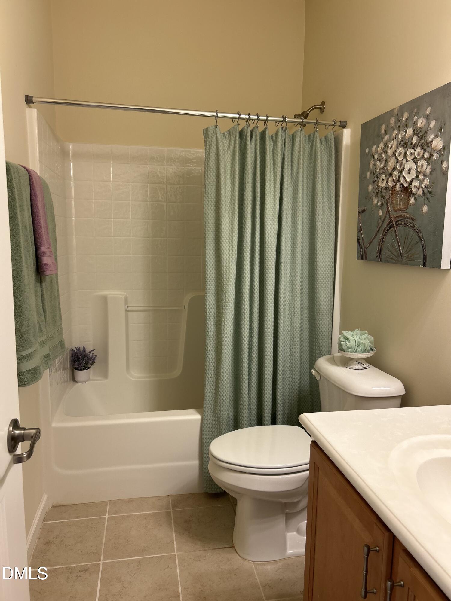 634 Edgewater Ridge Court Apex, NC 27523 - Photo 17 of 23 a bathroom with a toilet and a shower