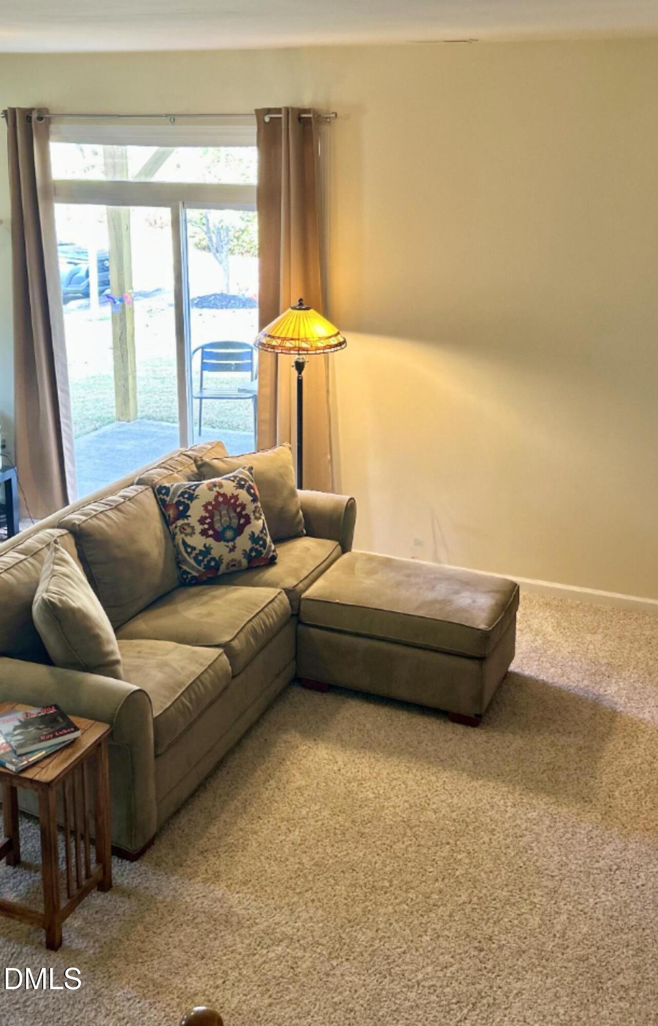 634 Edgewater Ridge Court Apex, NC 27523 - Photo 21 of 23 a living room with furniture and a large window