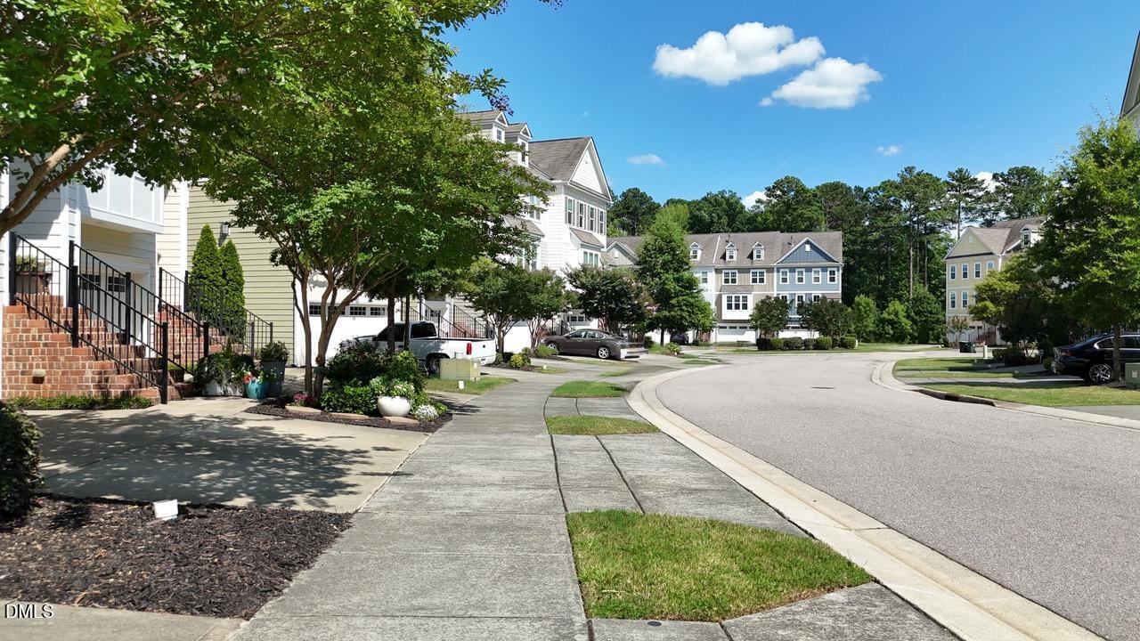 634 Edgewater Ridge Court Apex, NC 27523 - Photo 22 of 23 a view of a street with houses