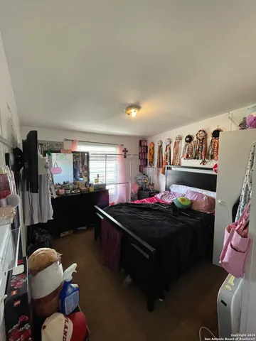 a room with furniture toys and a flat screen tv