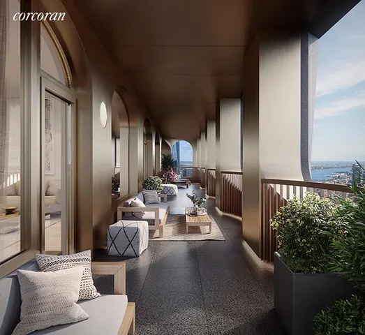 a view of a balcony that has couches and potted plants with sky view