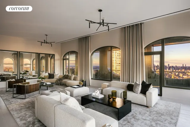 a dining hall with furniture a window and kitchen view