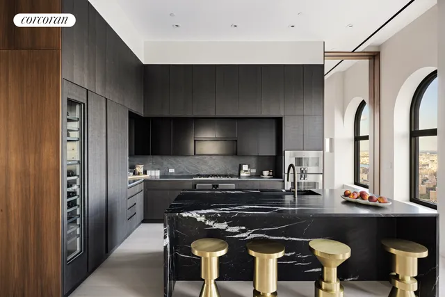 a dining hall with couches a coffee table and chairs