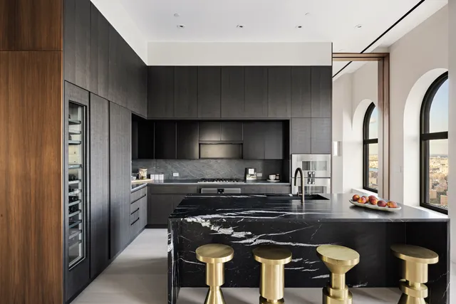 a kitchen with a table and chairs in it