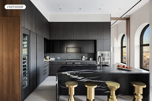 a front view of a house with swimming pool and furniture