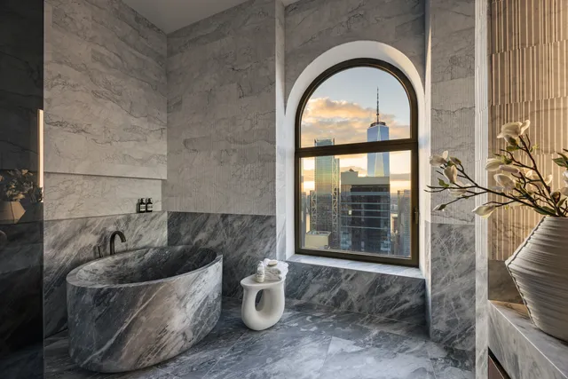 a view of a swimming pool with outdoor seating