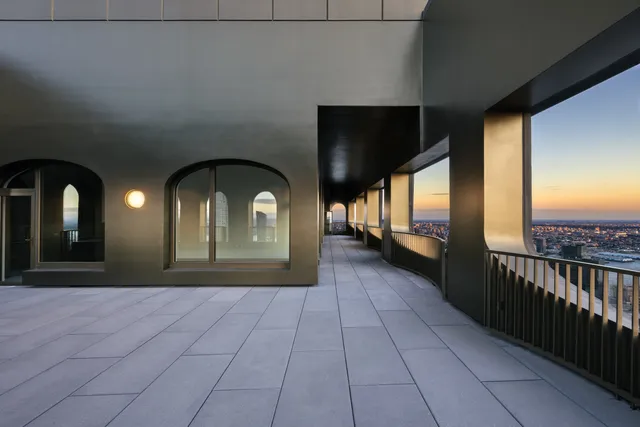 a front view of a house with entryway and wooden floor