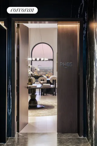 a living room with a bed furniture and a large window