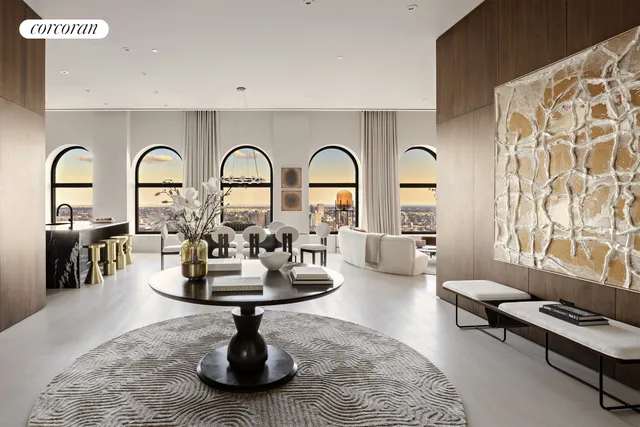 a living room with furniture flowerpot and a rug