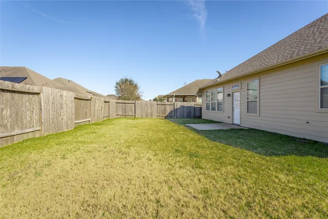 a view of a back yard of the house