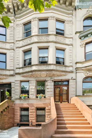a view of a two chairs in a patio