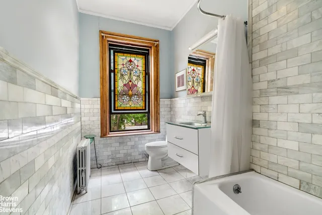 a view of a living room and bathroom