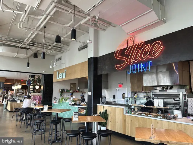 a front view of a building with potted plants