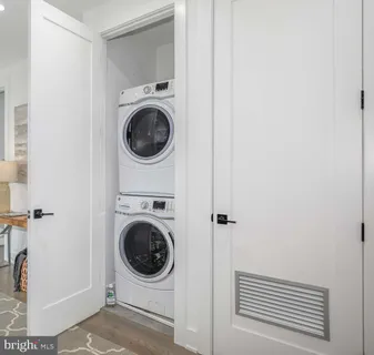 a kitchen with stainless steel appliances a stove a sink and a refrigerator