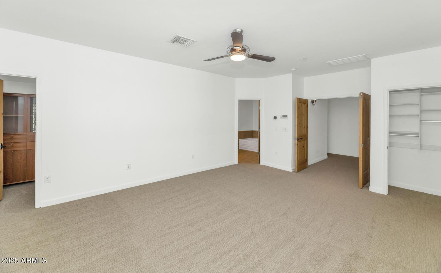 229 West Portland Street Phoenix, AZ 85003 - Photo 16 of 26 a view of an empty room with a chandelier