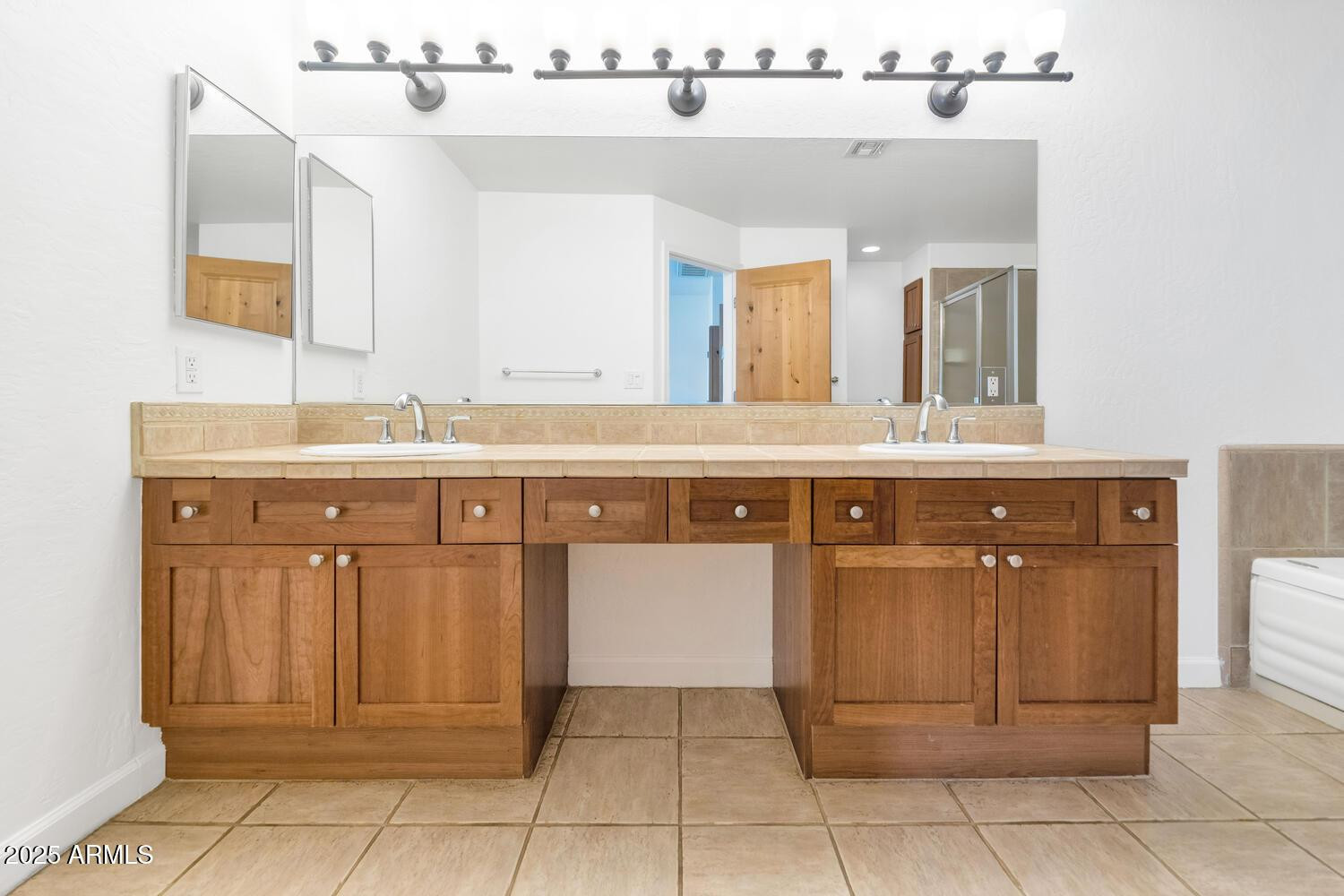 229 West Portland Street Phoenix, AZ 85003 - Photo 17 of 26 a spacious bathroom with a sink a mirror and a vanity