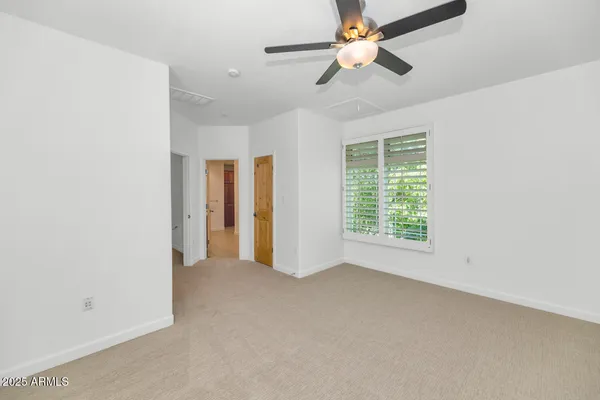 a view of an empty room with a window