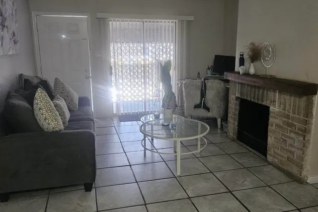 a living room with couches and a fireplace